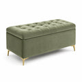 Banc de rangement en velours vert avec pieds en métal doré